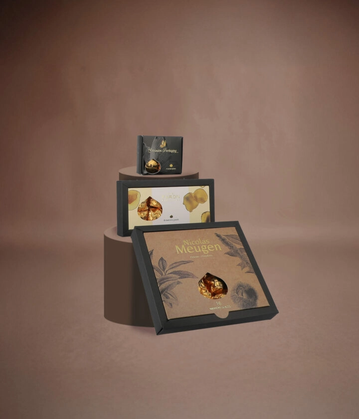 Boîte personnalisée de marrons glacés, emballage élégant pour les fêtes, disponible en plusieurs formats.
