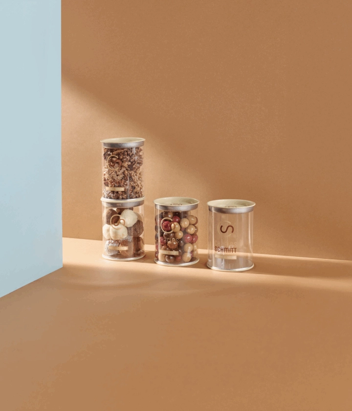 Tubes transparents personnalisés pour chocolats et autres créations sucrées, présentation élégante idéale pour artisans chocolatiers et confiseurs.