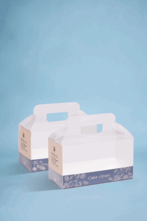Valisette cake personnalisée avec coque transparente et poignée, idéale pour présenter et transporter vos créations.